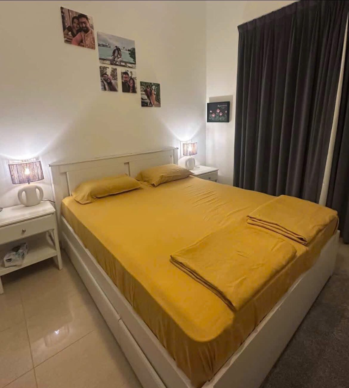 Mustard yellow linen fitted sheet and pillowcases on white bed frame - SCANDALINEN