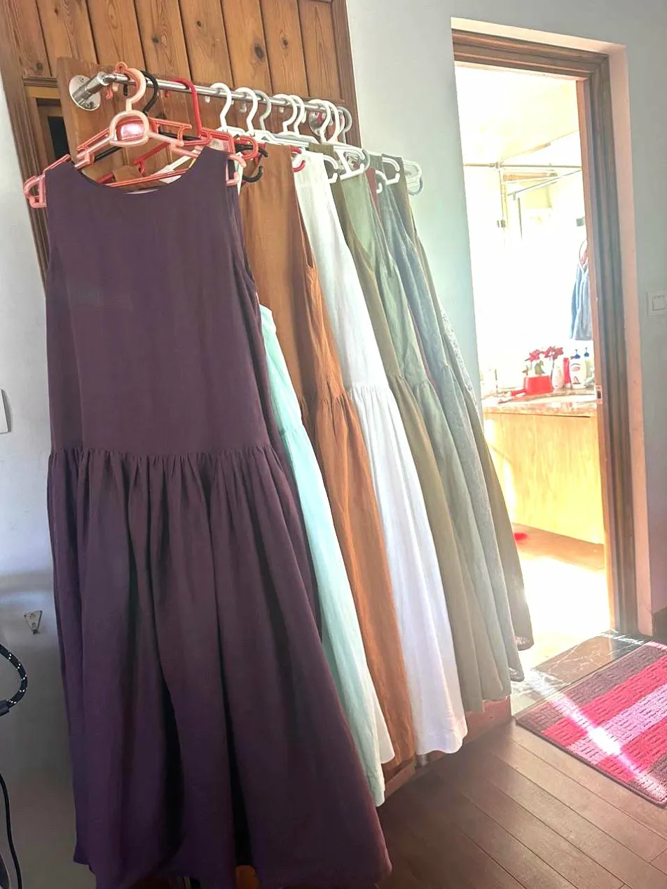 Custom linen dresses in 5 colors — purple, mint, camel, white, sage — made to order at SCANDALINEN workshop in Hanoi