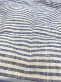 Navy pinstripe French linen quilted blanket on a bed, 100% European flax - SCANDALINEN
